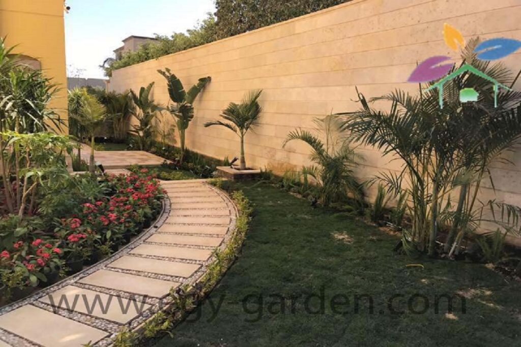 ممر حجري داخل حديقة منزلية مع نباتات
